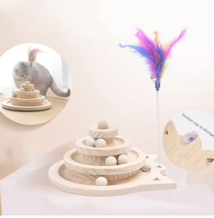 Wooden toy with colorful feathers and a cat in the background