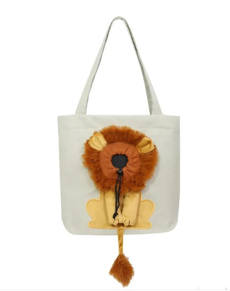 Cat sitting inside lion design pet carrier bag