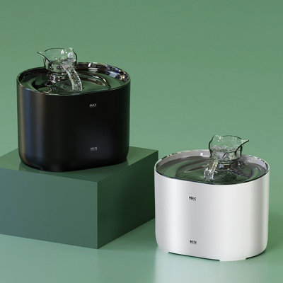 Two pet water fountains, one black and one silver, on a green background.