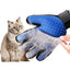 Blue cat grooming glove covered with removed pet hair next to a sitting cat