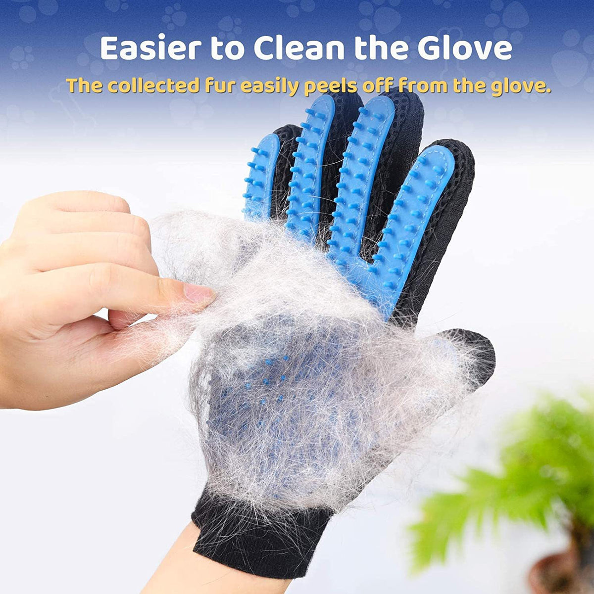 Pet grooming glove with blue bristles removing fur from a hand against a blurred background