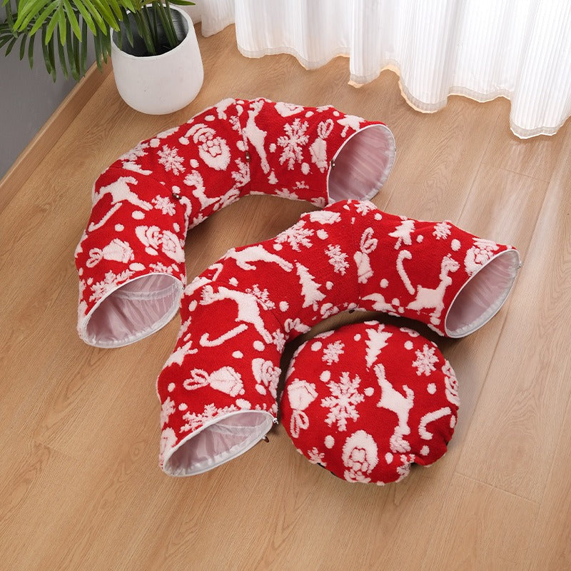 Red Christmas cat tunnel unzipped into curved tunnel sections and round cushion