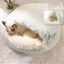 Plush shell-shaped cat bed side angle