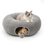 Cat resting inside tunnel bed