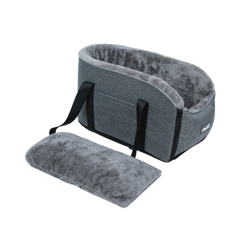 Gray pet carrier with a cushion on a white background