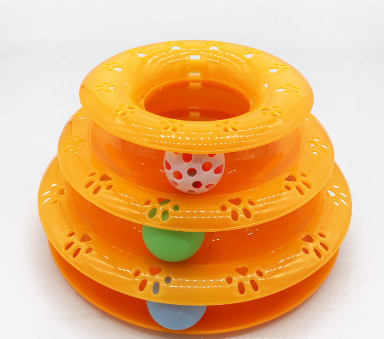 Orange 3-tier cat tower track toy with paw print cutouts and three colorful balls